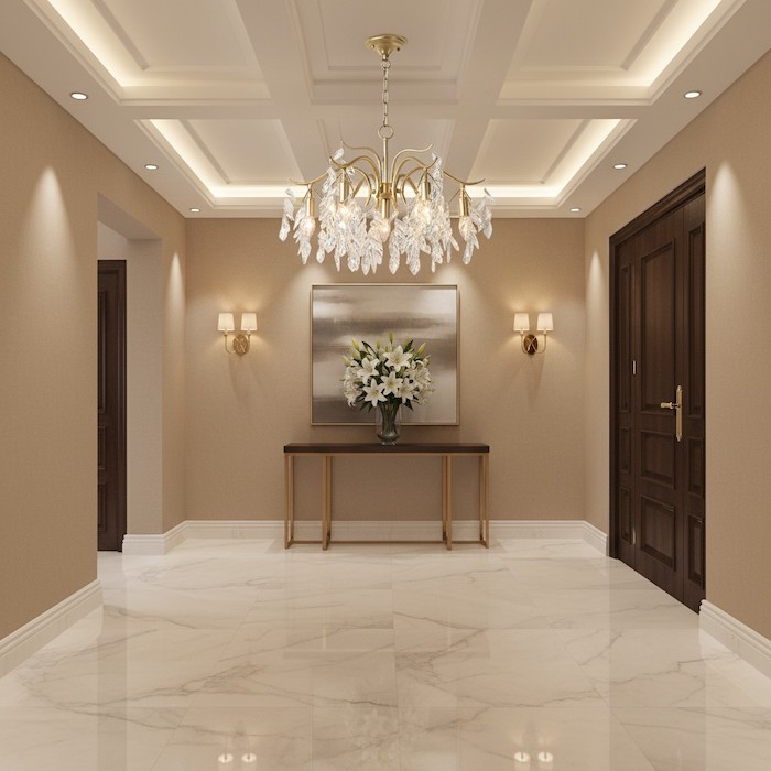 Grand entryway entryway with a hospitality-inspired crystal chandelier.
