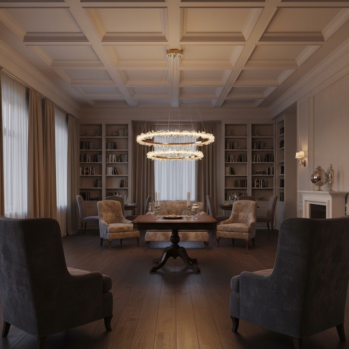 Warm evening ambiance created by a crystal chandelier in a tall room.