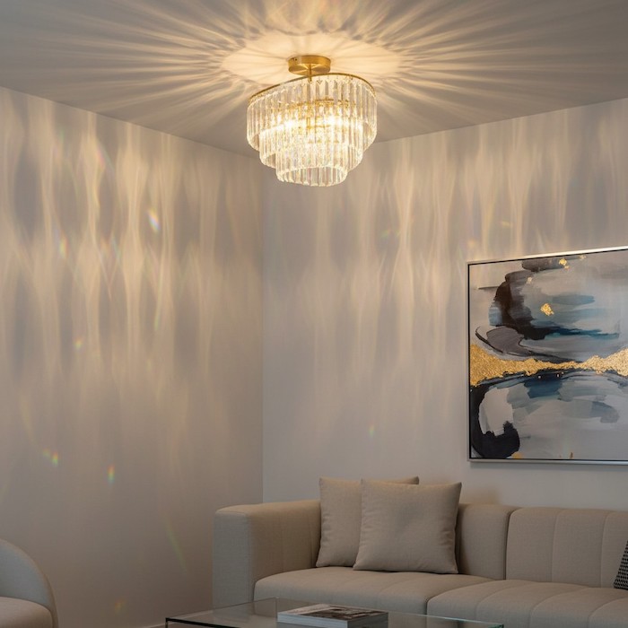 Prismatic light reflections on a wall from a crystal chandelier.