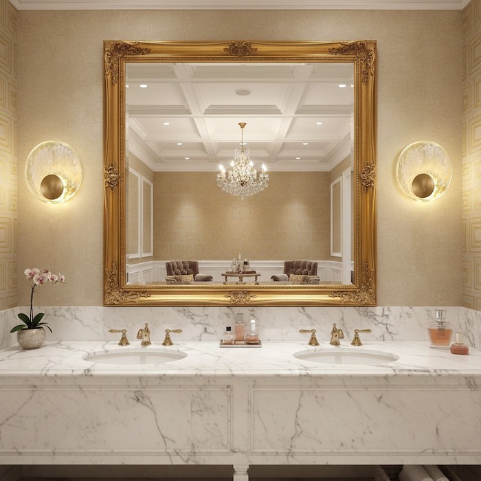 Gold and crystal wall lamps framing a luxury vanity mirror.