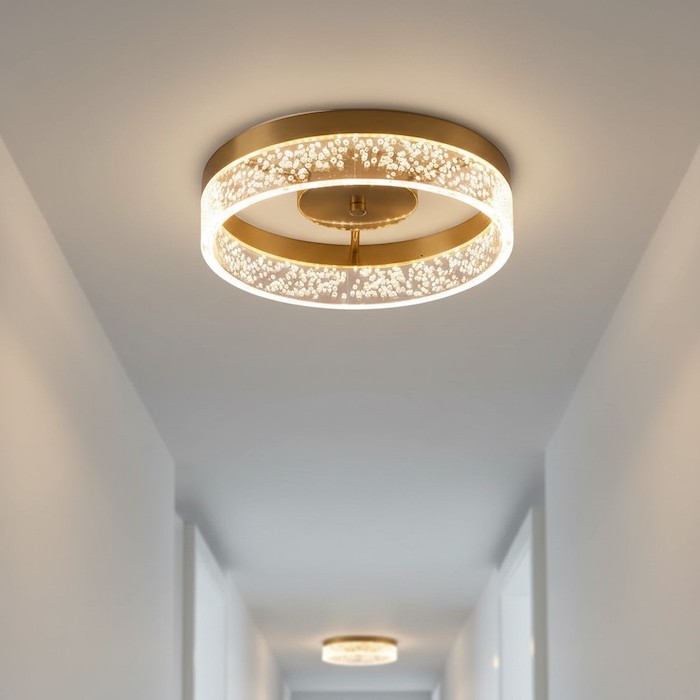 Low-profile ceiling light in clean hallway.