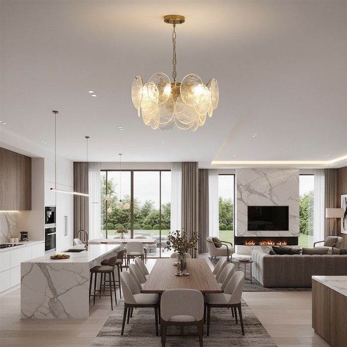 A wave-disc chandelier acting as a unifying element in an open-concept home.