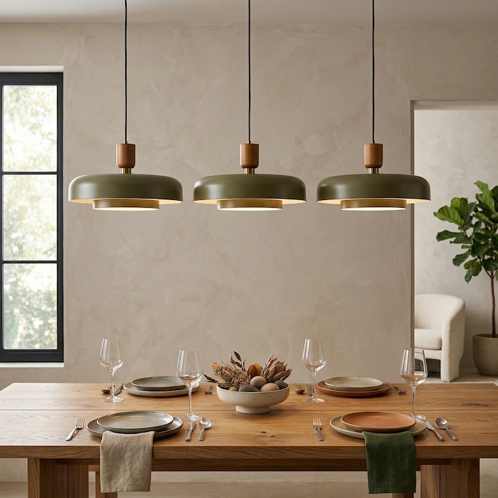 Properly scaled pendant light over a large wooden dining table.