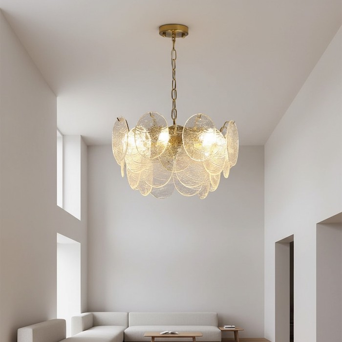 Vertical perspective of a wave-shaped chandelier breaking the ceiling plane.