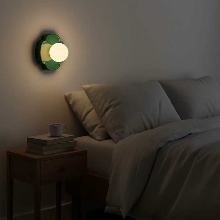 Soft diffused lighting from a ceramic orb lamp in a peaceful bedroom sanctuary.