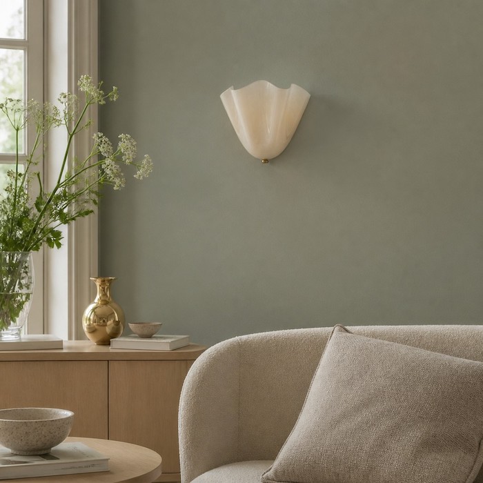 Elia seashell sconce as an art piece on a colored wall.
