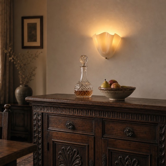 Art Deco glass sconce mounted above a dining room sideboard.