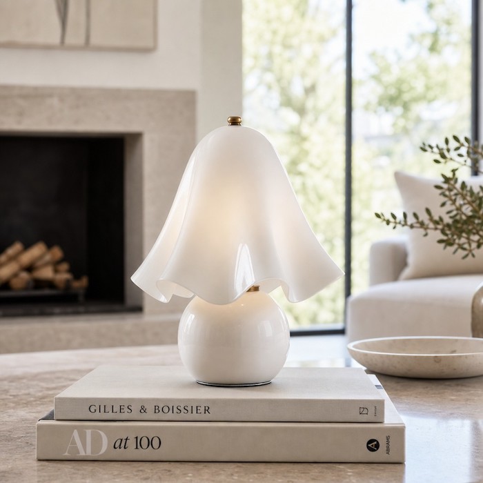 Sculptural glass table lamp as a piece of home decor.
