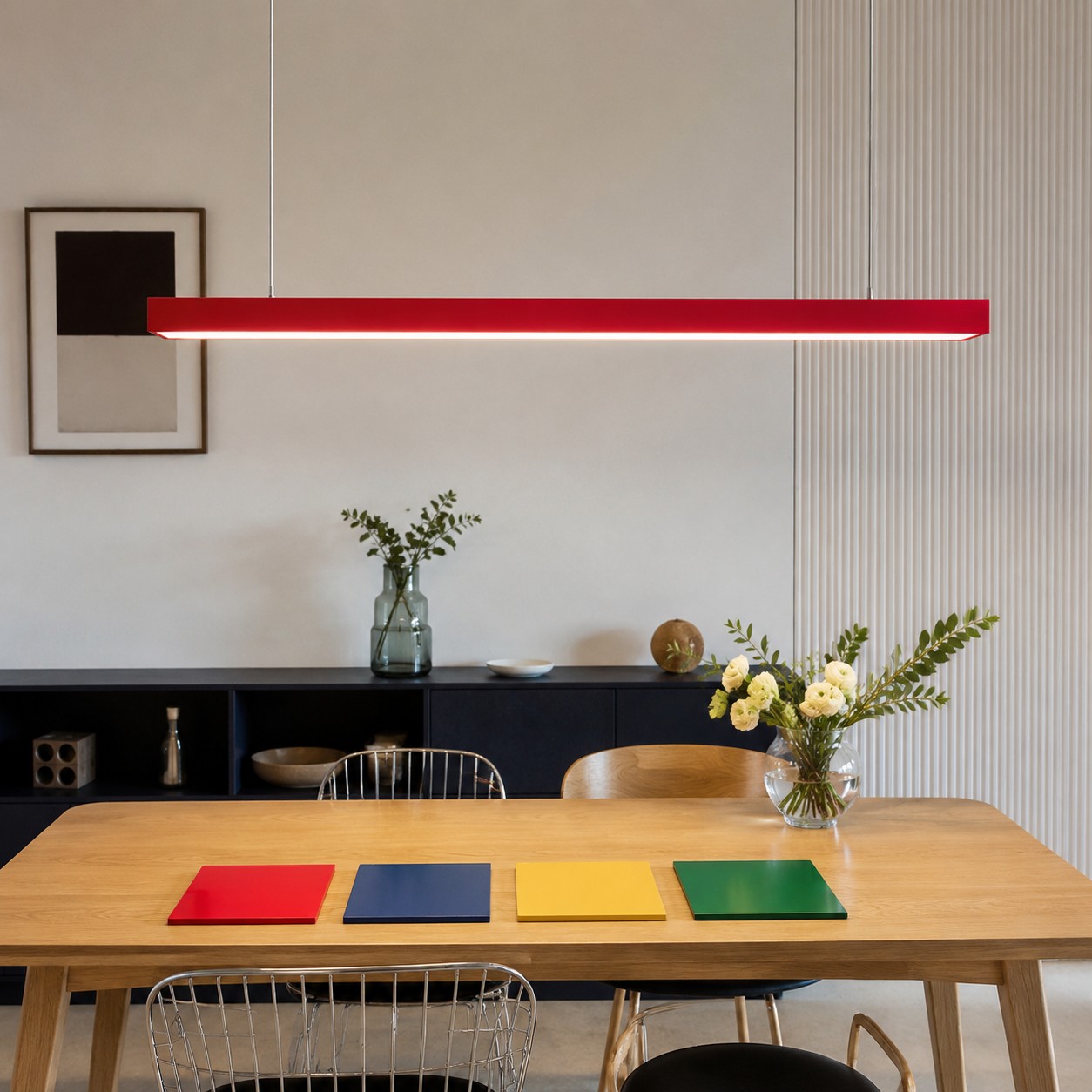 Red rectangular pendant selected after testing color samples with room materials