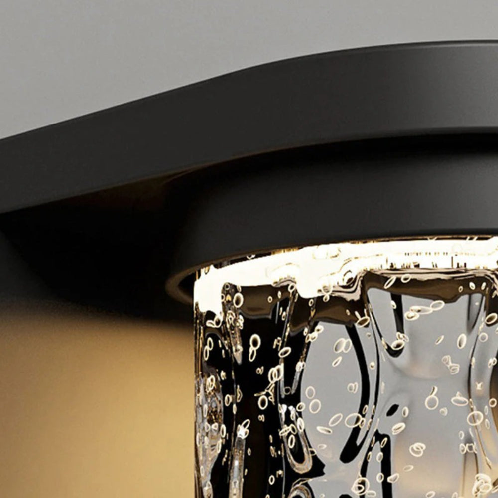 Lámpara de pared cilíndrica de vidrio acanalado para exteriores Drew00.webp__PID:67b45e77-f1d6-4a38-867f-42db0aa16806
