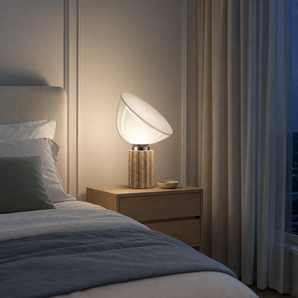 Taci lamp switched on in a Nordic light-luxury bedroom at night
