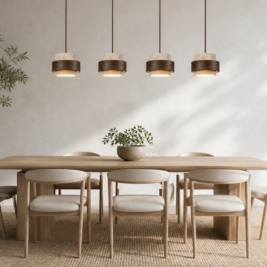 Four-head Timothy pendant above a long dining table