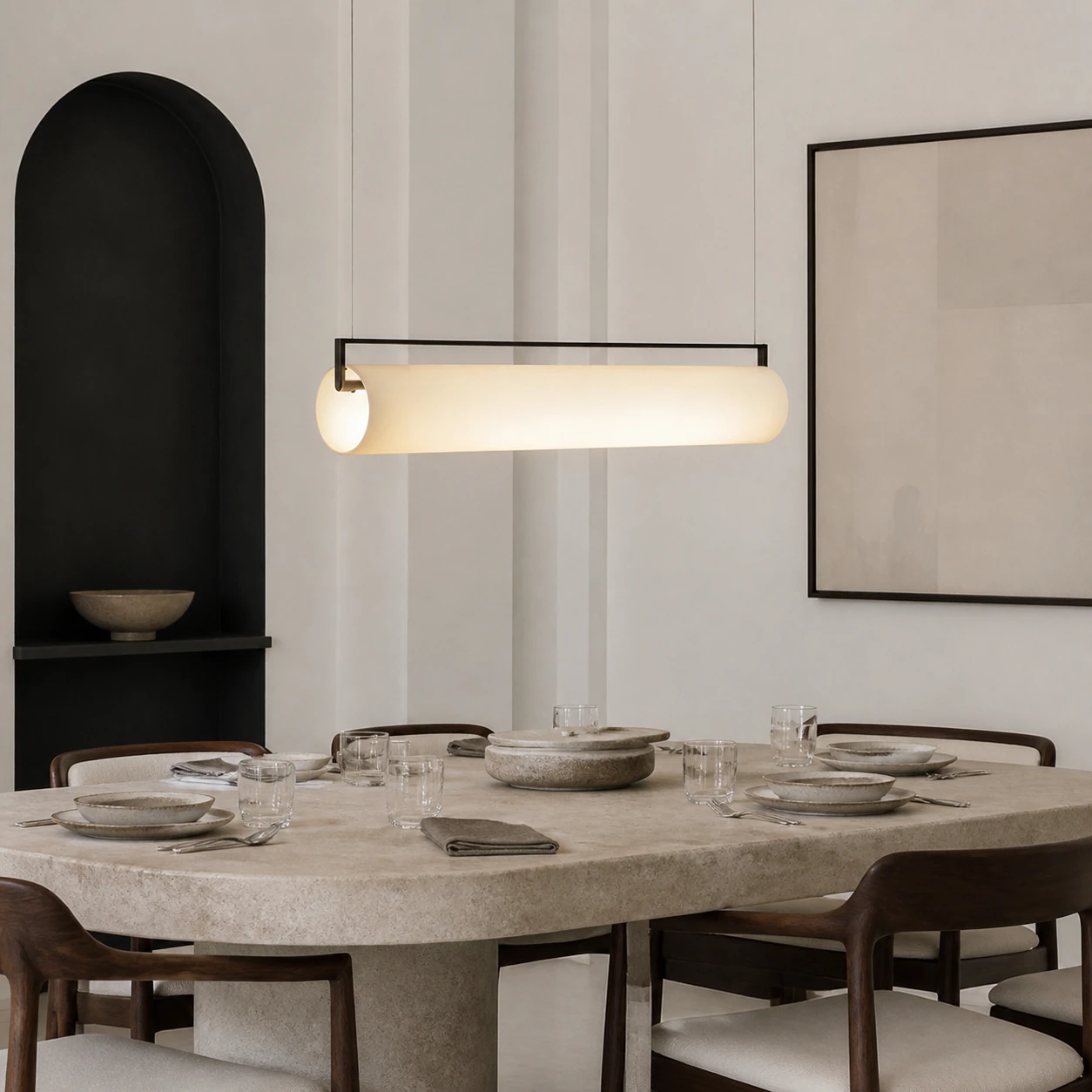 Single Edge cylindrical pendant in a material-rich editorial dining room