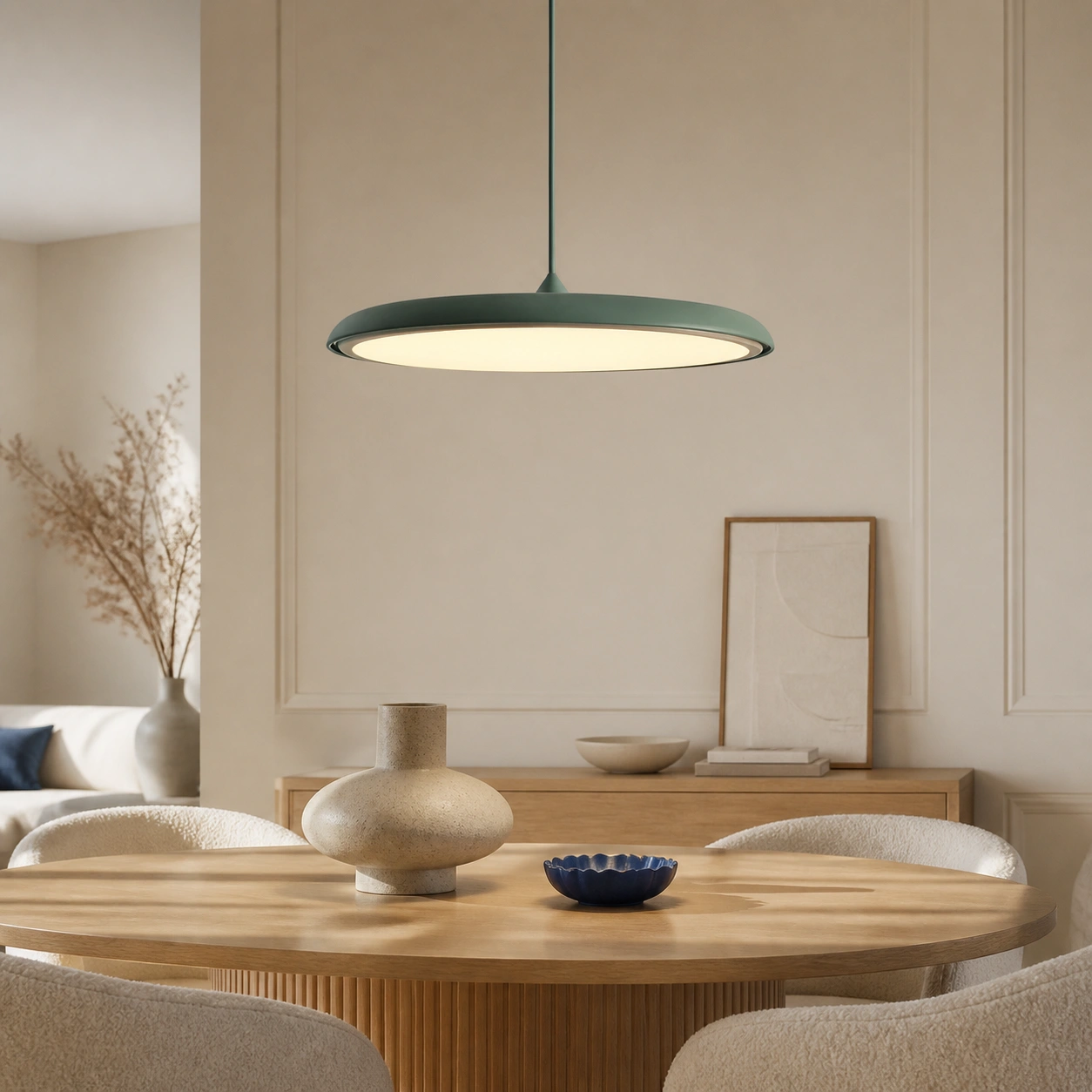 Green Lucian pendant switched on in a Nordic Bauhaus dining room