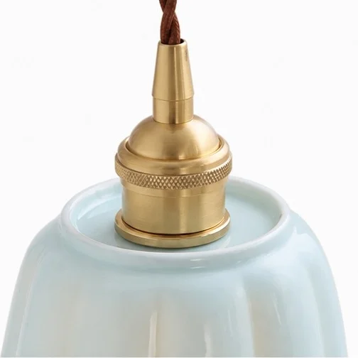 Close view of the warm brass lamp holder