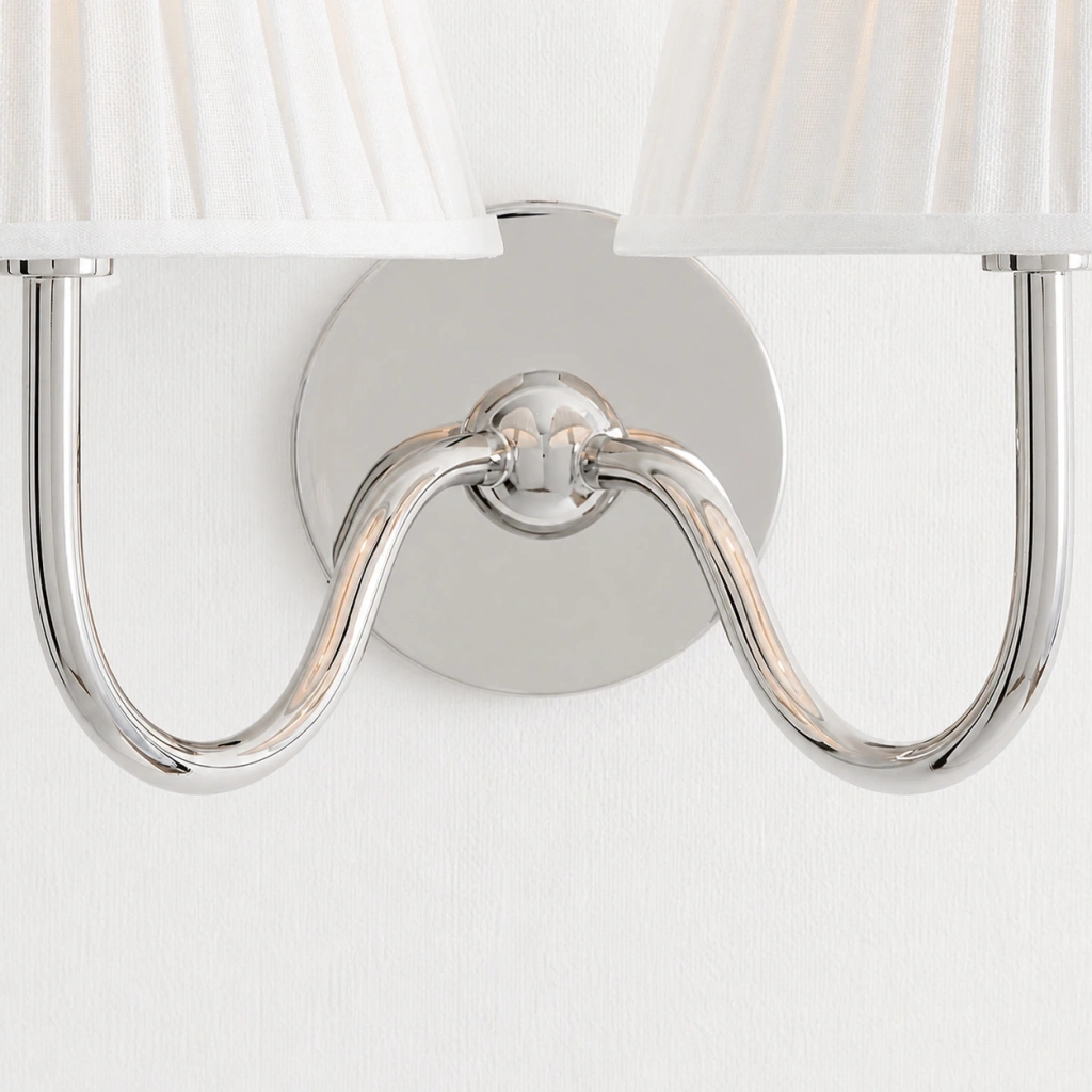 Close detail of the polished nickel twin-head junction