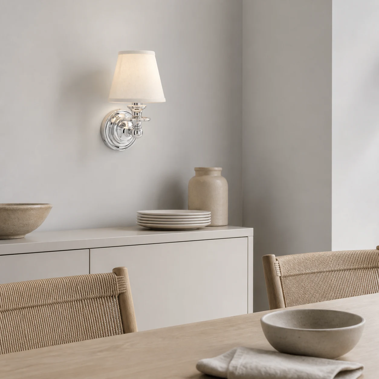 Dryadis nickel wall sconce in a Nordic dining space