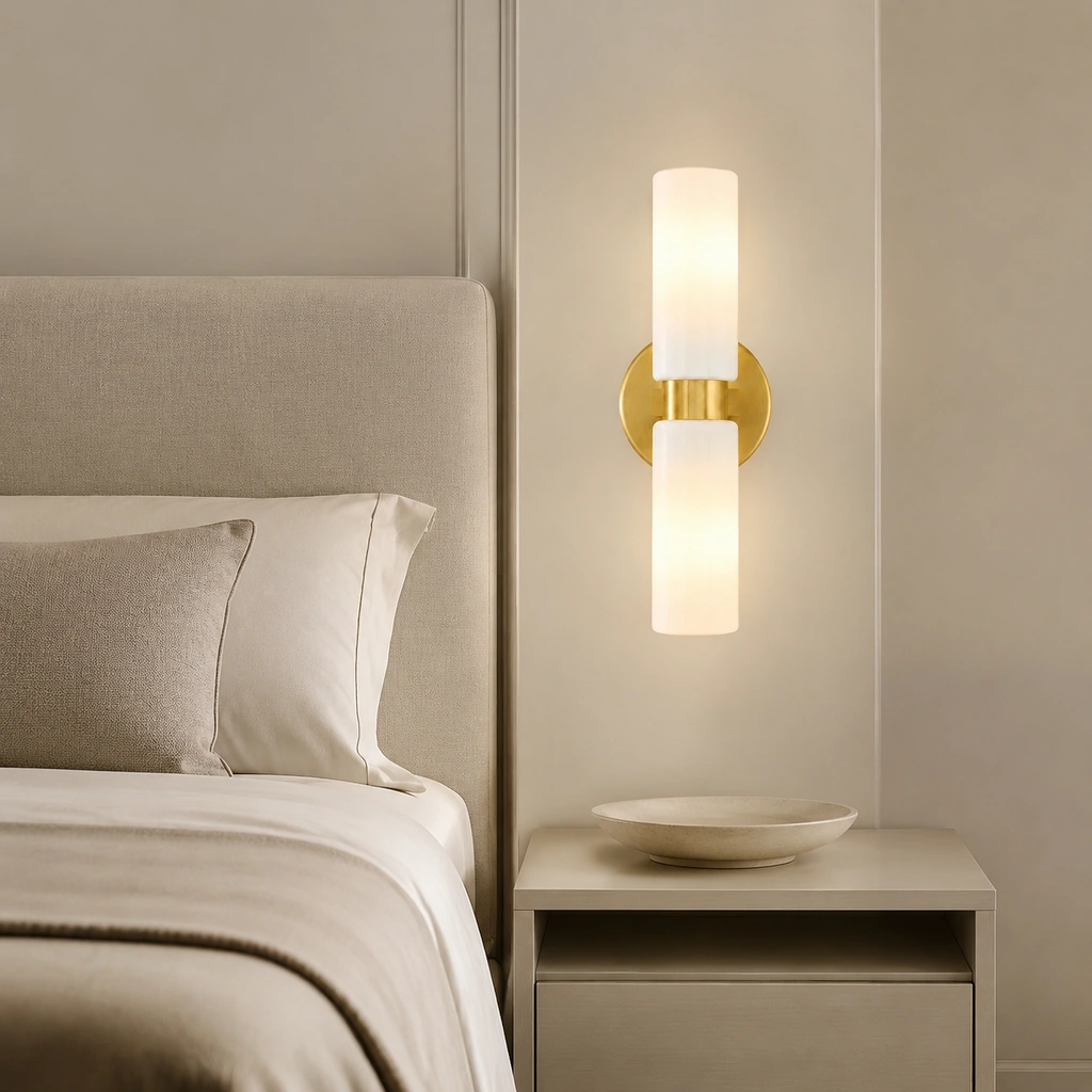 A calm glow above the bedside table.