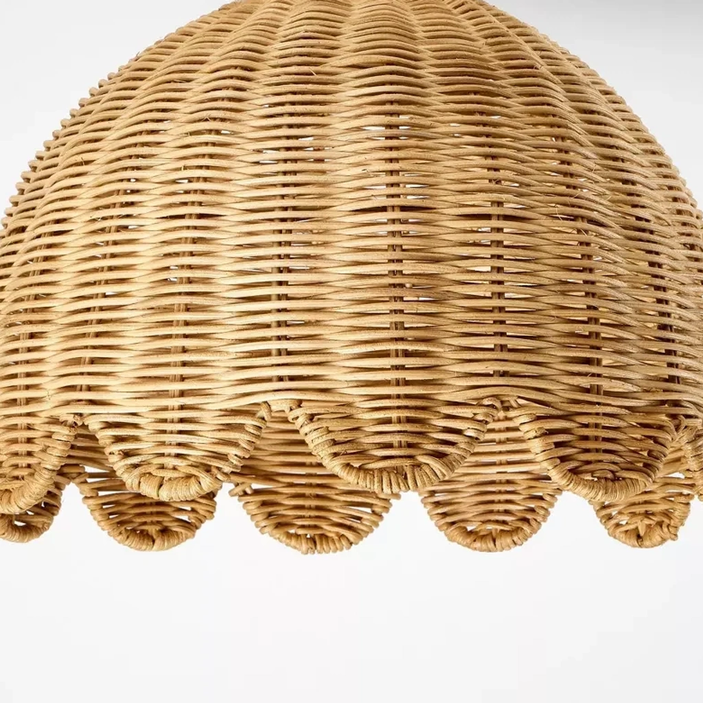 Close view of the sculpted scalloped rattan edge