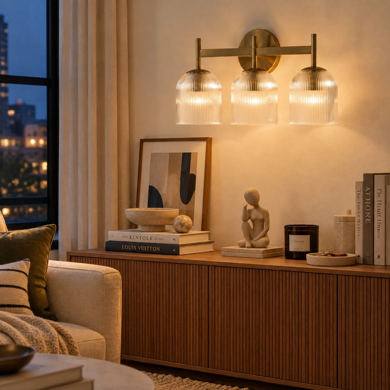 Three-head wall light in a warm living space