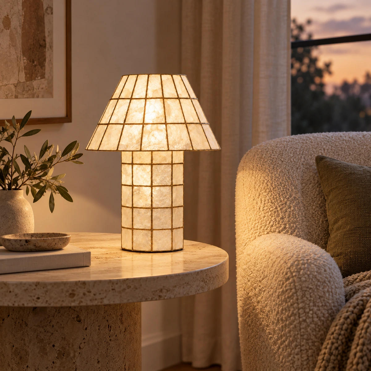 Capiz shell glow table lamp beside a reading chair