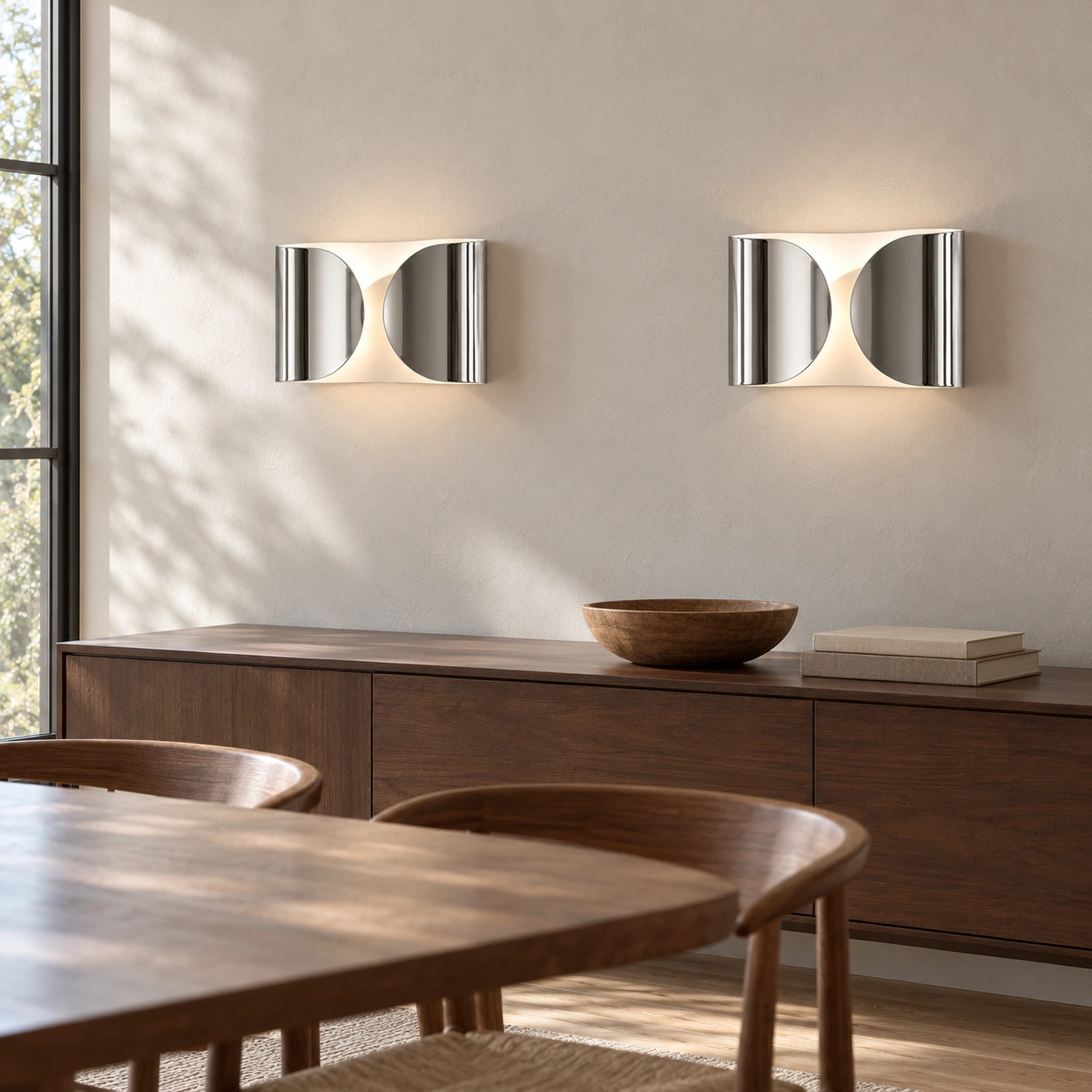 Chrome Foglio wall lights in a dining room
