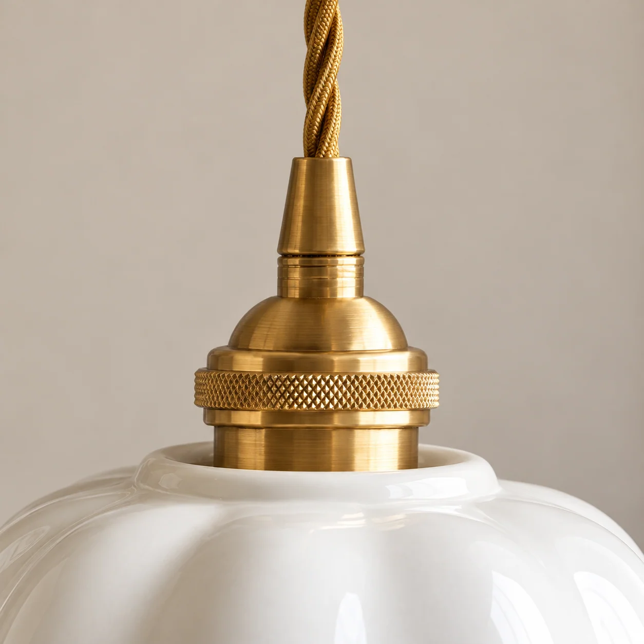 Close detail of the pendant brass holder and cord