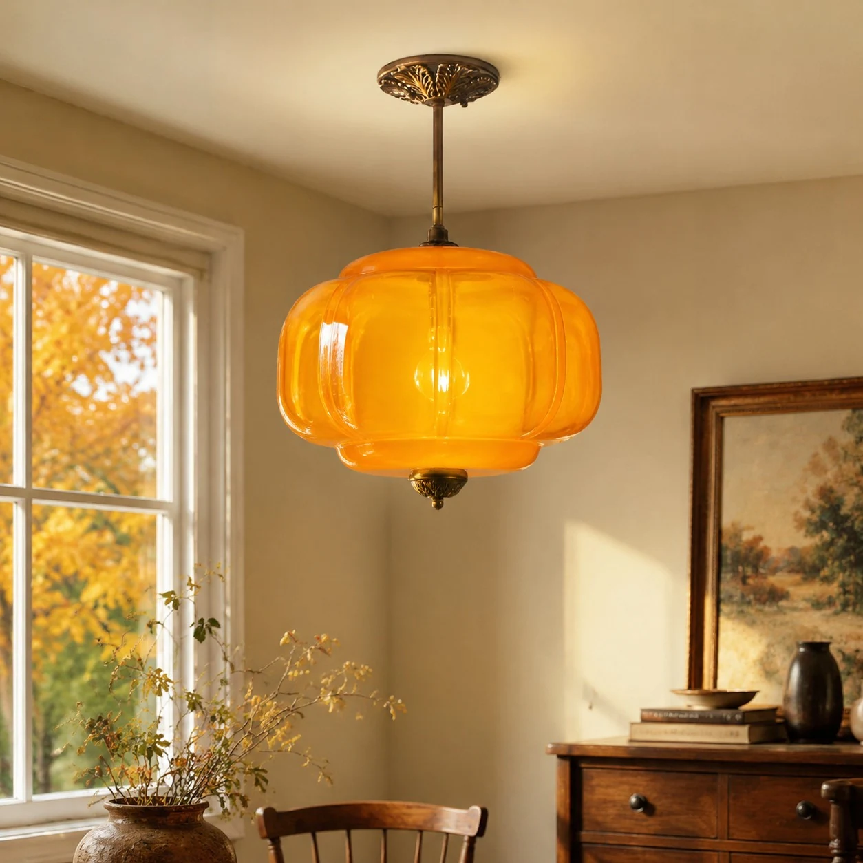 Orange glass ceiling light in a sunlit room